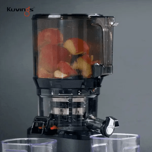 Kuvings blender with fruits inside on a gray background
