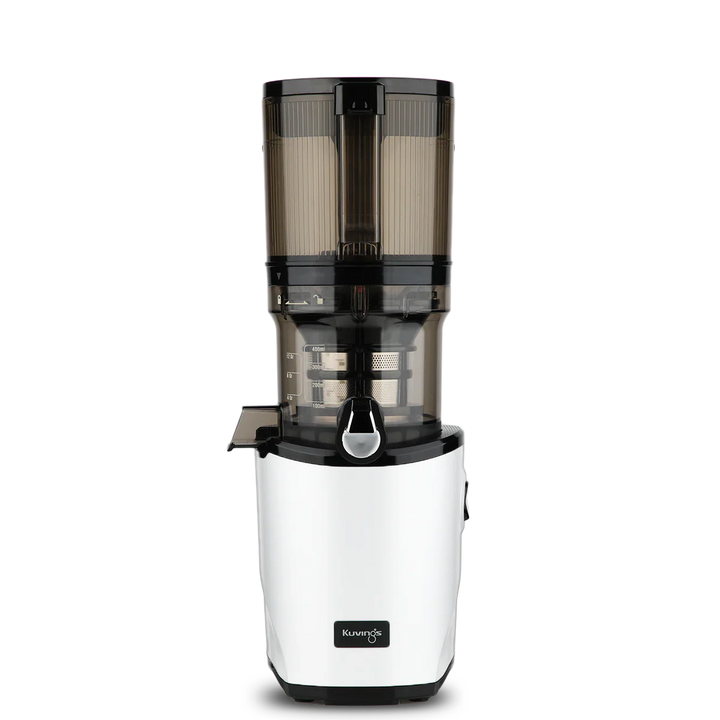 Straight-on studio product shot of a white Kuvings AUTO8 whole slow juicer featuring a large 2000ml transparent grey auto-hopper container assembly, isolated against a transparent grid background.