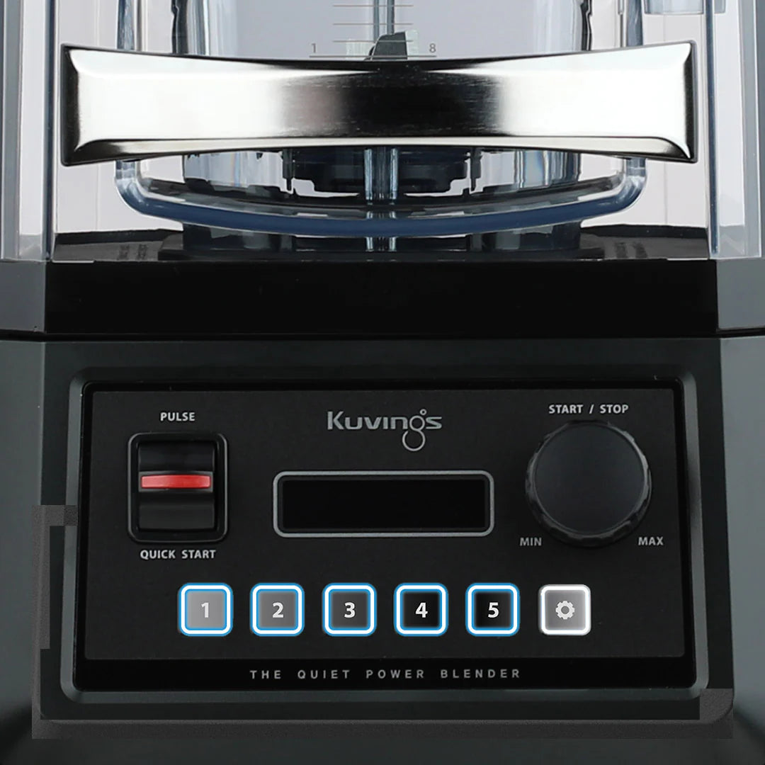 Straight-on, close-up front view of the Kuvings CB850 Quiet Power Blender control panel, showing the digital interface with illuminated menu buttons, a speed dial, and the blender jar handle above.
