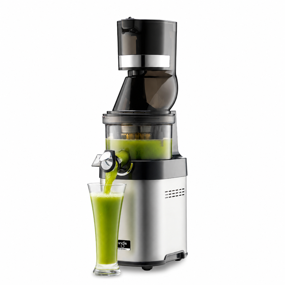 Kuvings cs600 silver juicer dispensing green juice into a glass on a white background