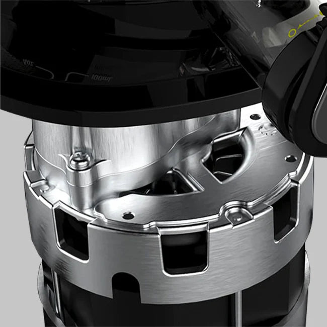 Close-up studio conceptual shot highlighting the brushed silver metal casing of the heavy-duty commercial-grade motor assembly inside a Kuvings REVO830 whole slow juicer against a grey background.